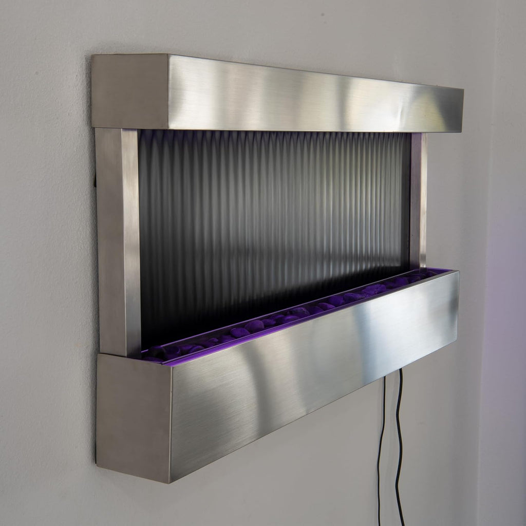 XBrand 47' Indoor Wall-Mounted Waterfall Mirror Fountain with LED Lighting, Silver Metal Décor, and Rock Base – Modern Relaxing Water Feature for Home
